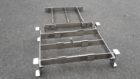 Security bars. As deployed (but inverted) in the foreground and closed for ease of stowage