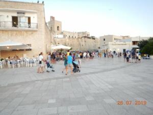 The walls of Otranto on a busy Friday evening