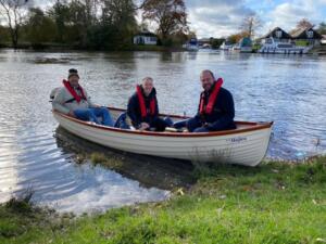 Two carers taking a senile old git out for the day in the 'sunshine boat'.